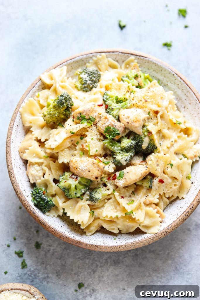creamy Alfredo Pasta with chicken and broccoli in a bowl. 