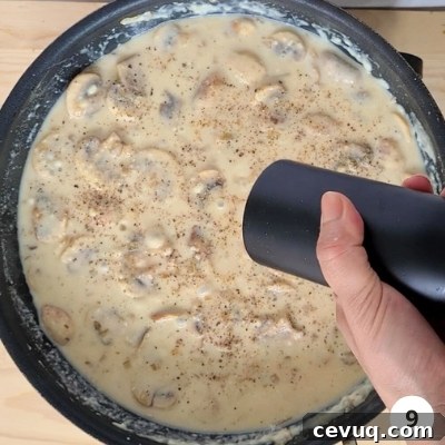 Creamy Mushroom Pasta Without Cream — Dairy-Free Recipe 12 pepper being added into creamy mushroom sauce