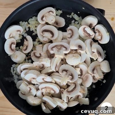 Creamy Mushroom Pasta Without Cream — Dairy-Free Recipe 5 Mushrooms added into skillet