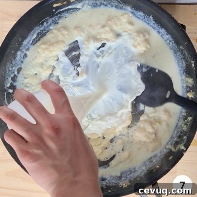 Creamy Mushroom Pasta Without Cream — Dairy-Free Recipe 10 milk slowly being added into skillet of butter and flour mixture