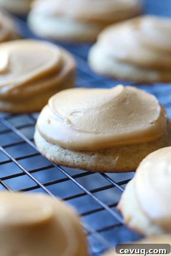 Close up of frosted banana cookies on a wire rack.