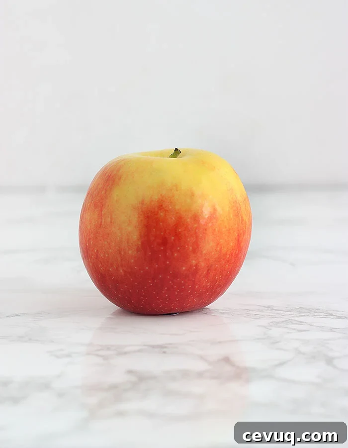 yellow and pink jazz apple on a white background