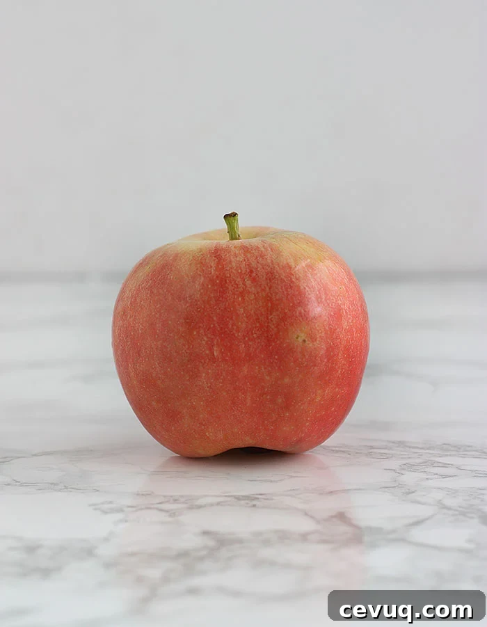 pink gala apple on a white background