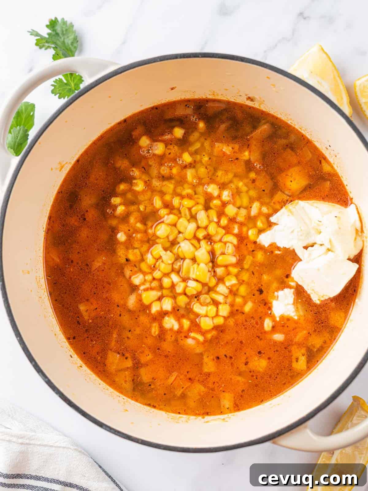white chicken chili ingredients in a pot before adding the shredded chicken
