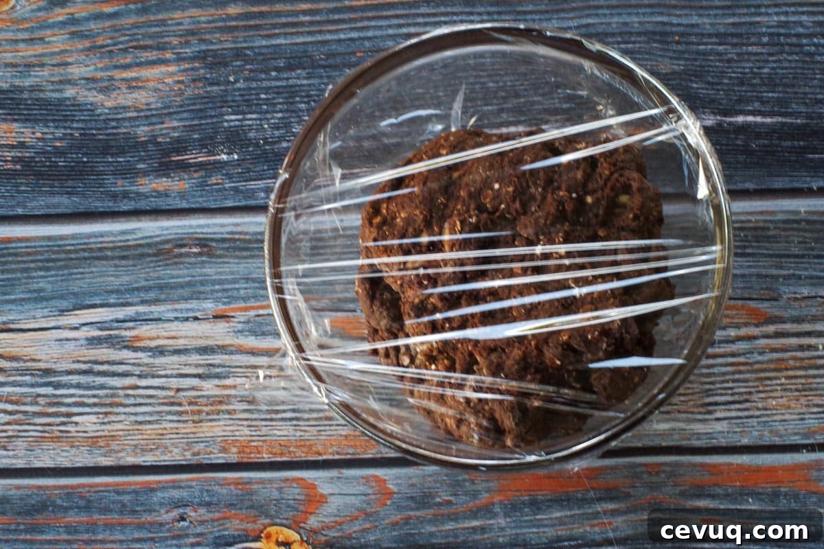 Chocolate Zucchini Biscotti Recipe: Crunchy, Moist, and Perfect for Coffee 8 biscotti dough in a small glass bowl, covered with plastic wrap