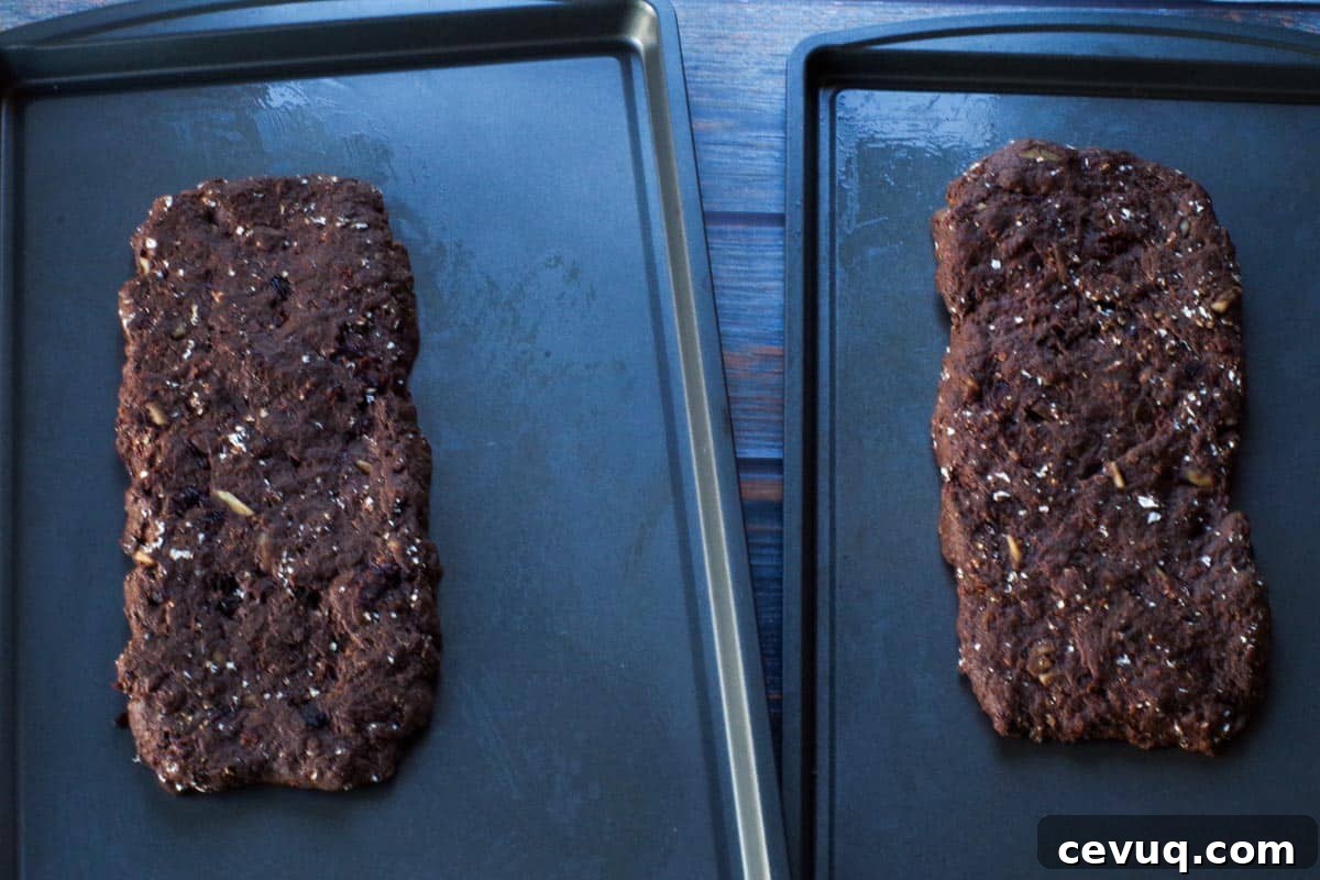 Chocolate Zucchini Biscotti Recipe: Crunchy, Moist, and Perfect for Coffee 9 2 biscotti loaves ready for baking on baking sheets