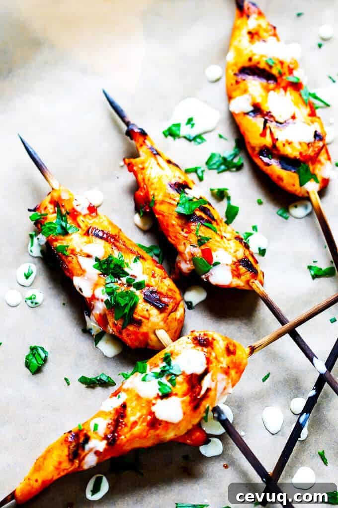 Honey Harissa Chicken Skewers with Garlic Mint Sauce - Mediterranean flavors in tasty skewers with refreshing garlic mint sauce.