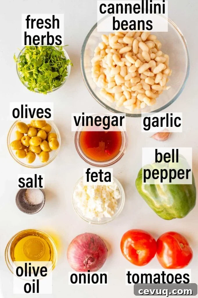 Labelled ingredients including cannellini beans, fresh herbs, olives, garlic and tomatoes.