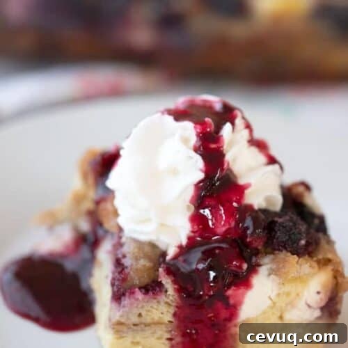 This is an easy mixed berry overnight French toast bake.  It’s made with simple ingredients, frozen mixed berries, milk, cream cheese, and eggs.  It’s a delicious overnight French toast casserole with streusel topping.