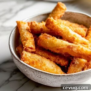Crispy Homemade Egg Rolls: Step-by-Step Recipe for Perfect Rolls 9 Crispy fried homemade egg rolls in a white bowl.