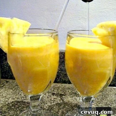 Creamy Tropical Smoothie. A lovely cool, refreshing drink using pineapple, mango, banana and strawberry. Quick and easy, perfect to start your morning off happy