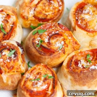 These Air Fryer Pizza Rolls have delicious pepperoni and mozzarella cheese packed in pizza pockets – an instant crowd-pleaser great for appetizer or snack. You can easily make these bite-sized mini pizzas at home from scratch in under 10 minutes. We’ve also included instructions on how to air fry frozen pizza puffs straight from the freezer.