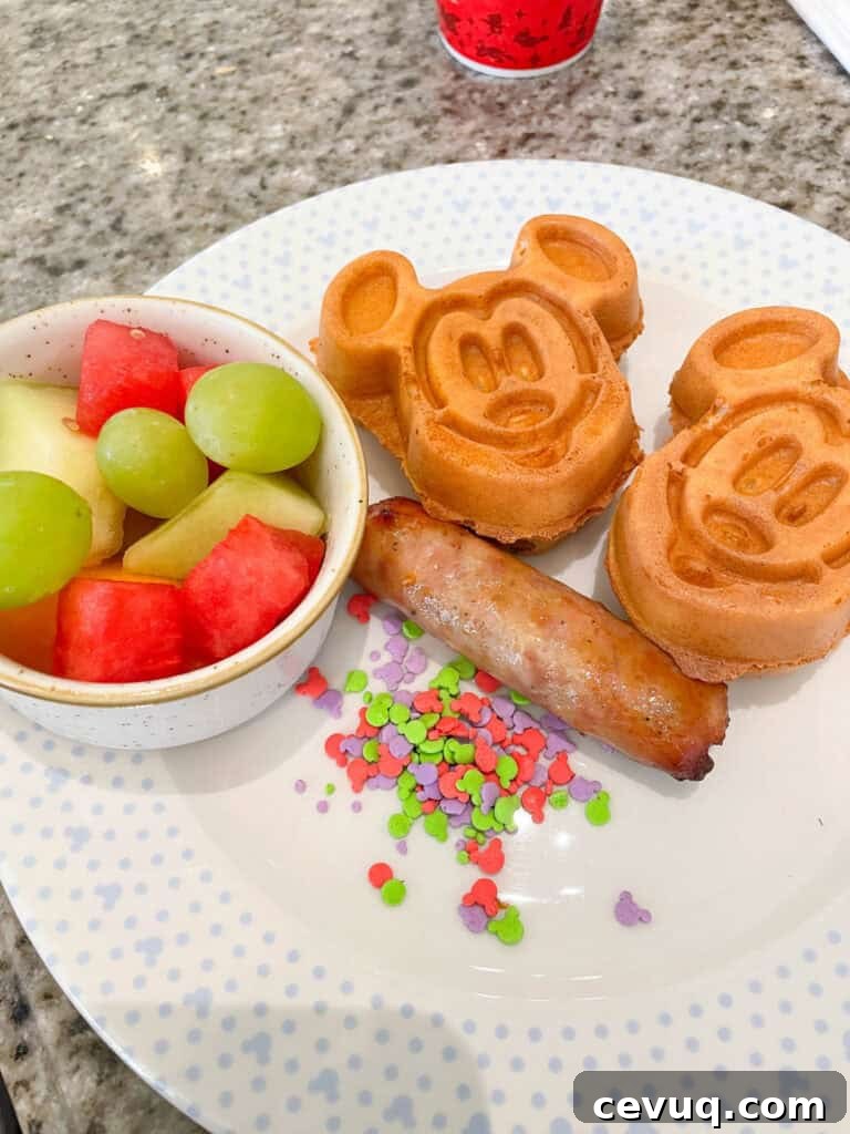 Kids breakfast Mickey waffles and sausage from Grand Floridian Cafe.