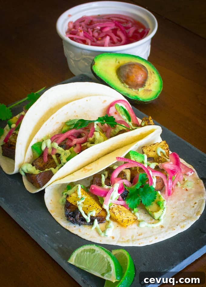 Pork Belly Tacos with Pickled Onion, Roasted Pineapple, and Avocado Lime Sour Cream | Savorwithjennifer.com