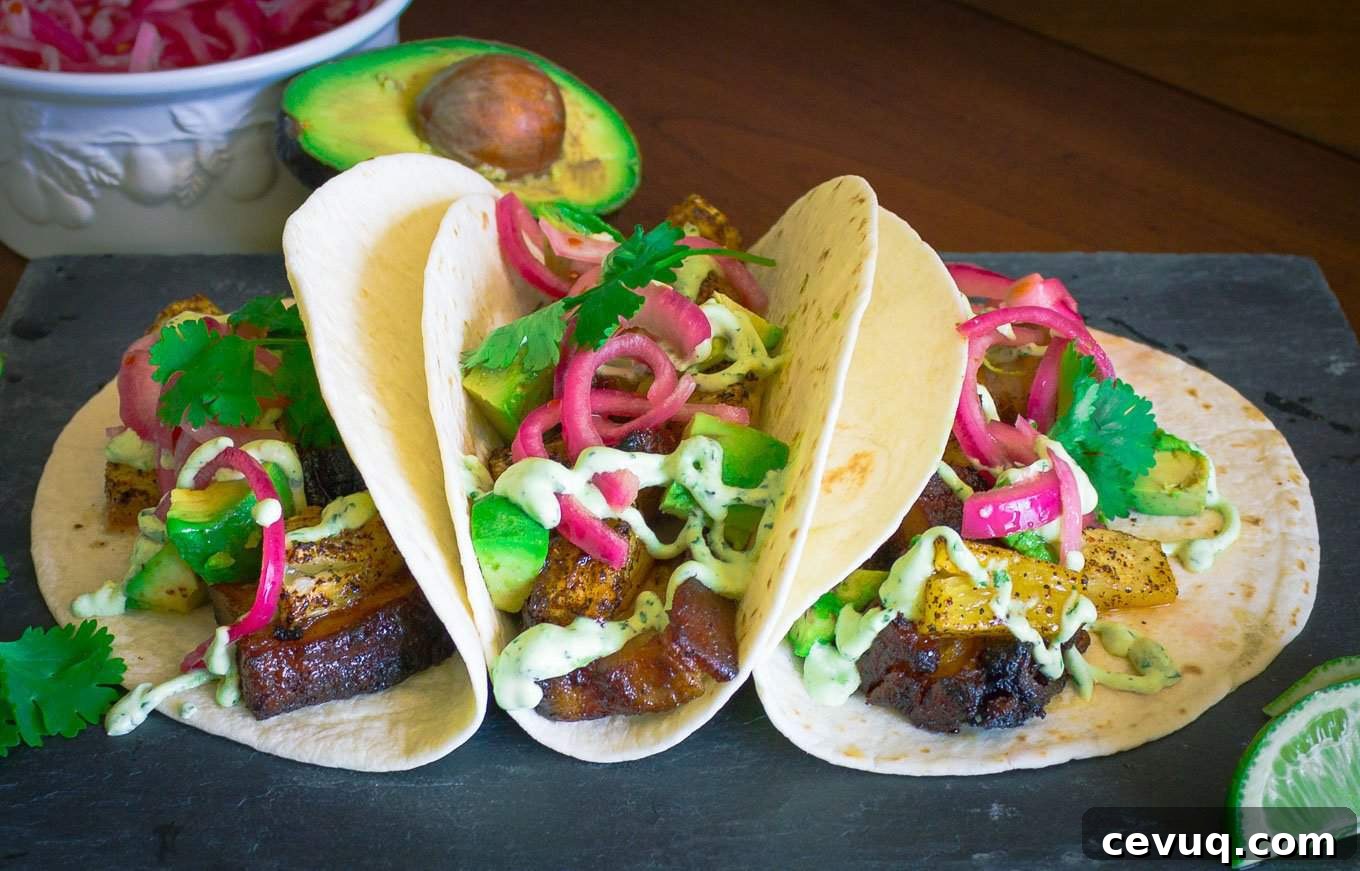 Pork Belly Tacos with Pickled Onion, Roasted Pineapple, and Avocado Lime Sour Cream | Savorwithjennifer.com