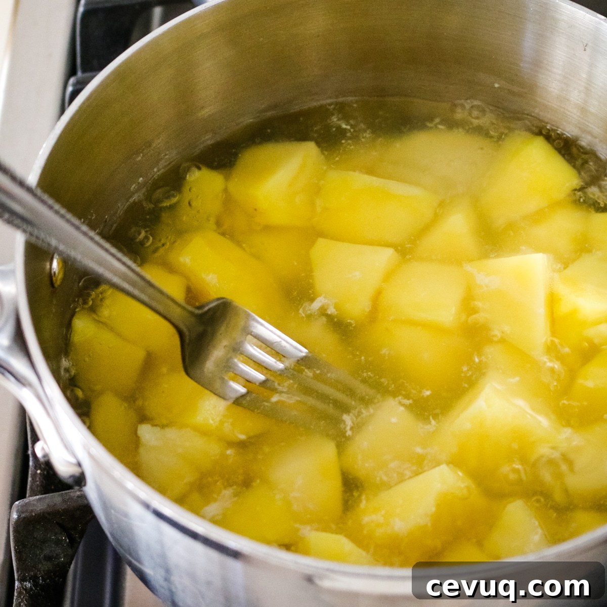 Potatoes in a pan with water.
