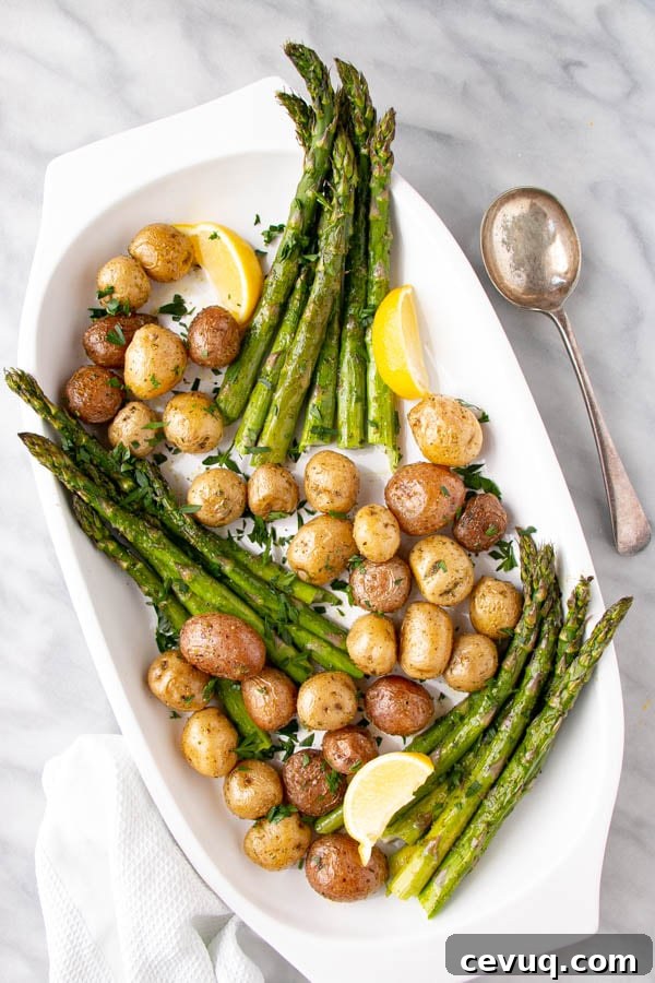 Lemon Herb Roasted Potatoes and Asparagus by My Kitchen Love // 30 Zesty & Bright Savory Lemon Recipes // FoodNouveau.com