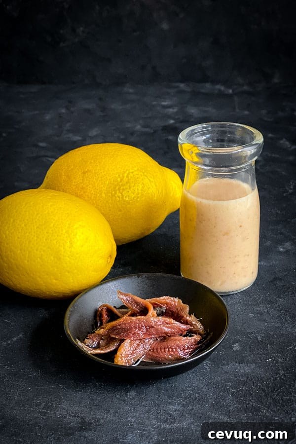 Anchovy Lemon Vinaigrette by The Devil Wears Salad // 30 Zesty & Bright Savory Lemon Recipes // FoodNouveau.com
