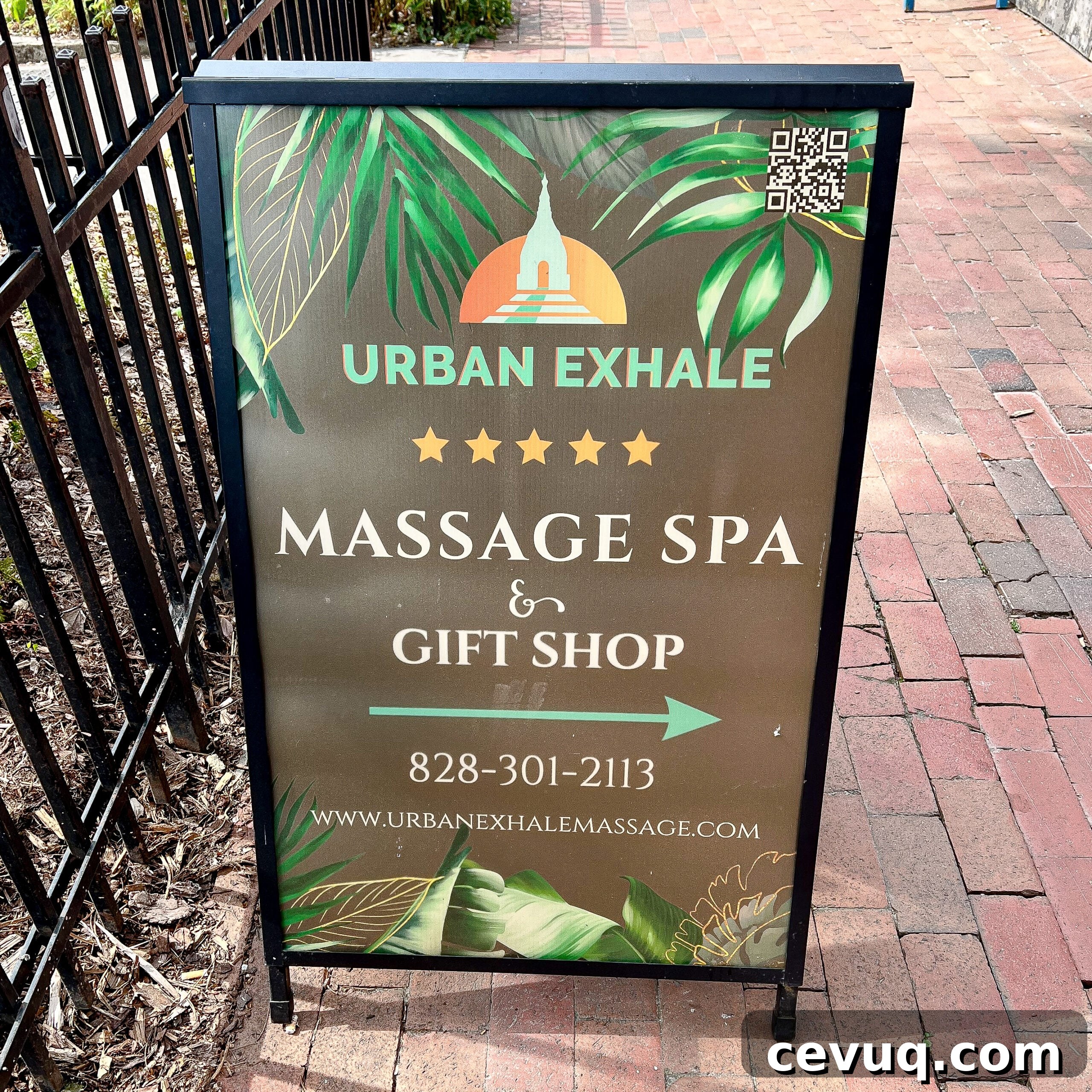Urban Exhale sidewalk sign with spa branding.