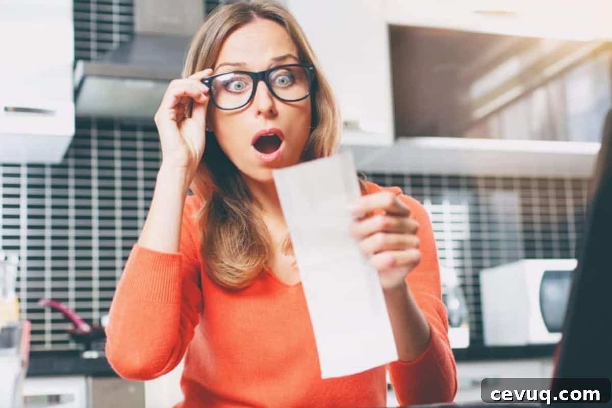 Woman looking at grocery bill in shock 