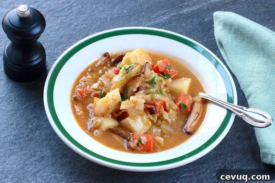 Hearty Vegan Irish Stew Recipe for St. Patrick’s Day 2 A bowl of Vegan Irish Stew with spoon, napkin, and pepper mill
