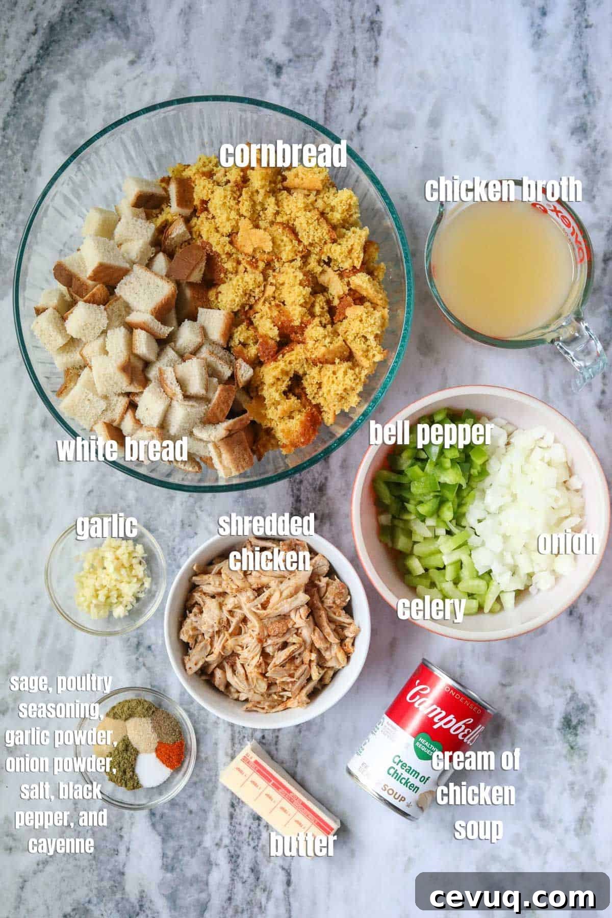 Ingredients for making southern chicken and dressing arranged on a gray marble surface.