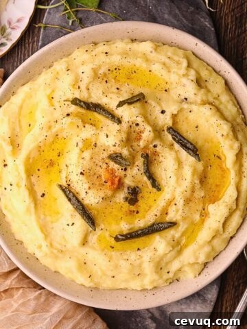 Brown butter, sage, mashed potatoes in a serving bowl.
