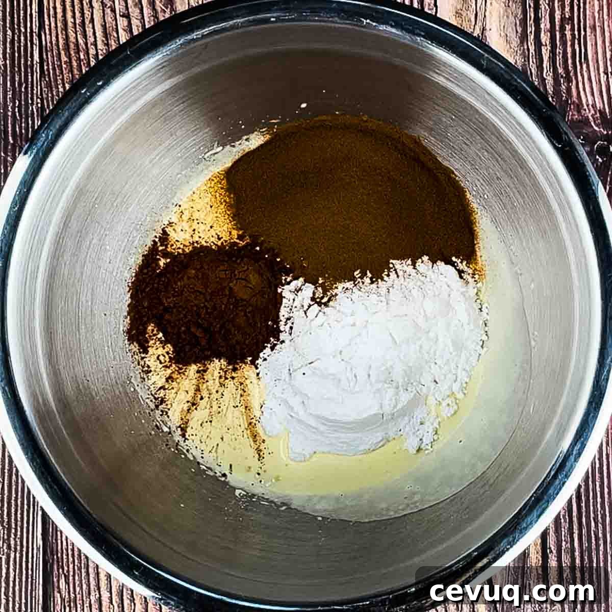 The cocoa, espresso powder, and powdered sugar added to the egg mixture.