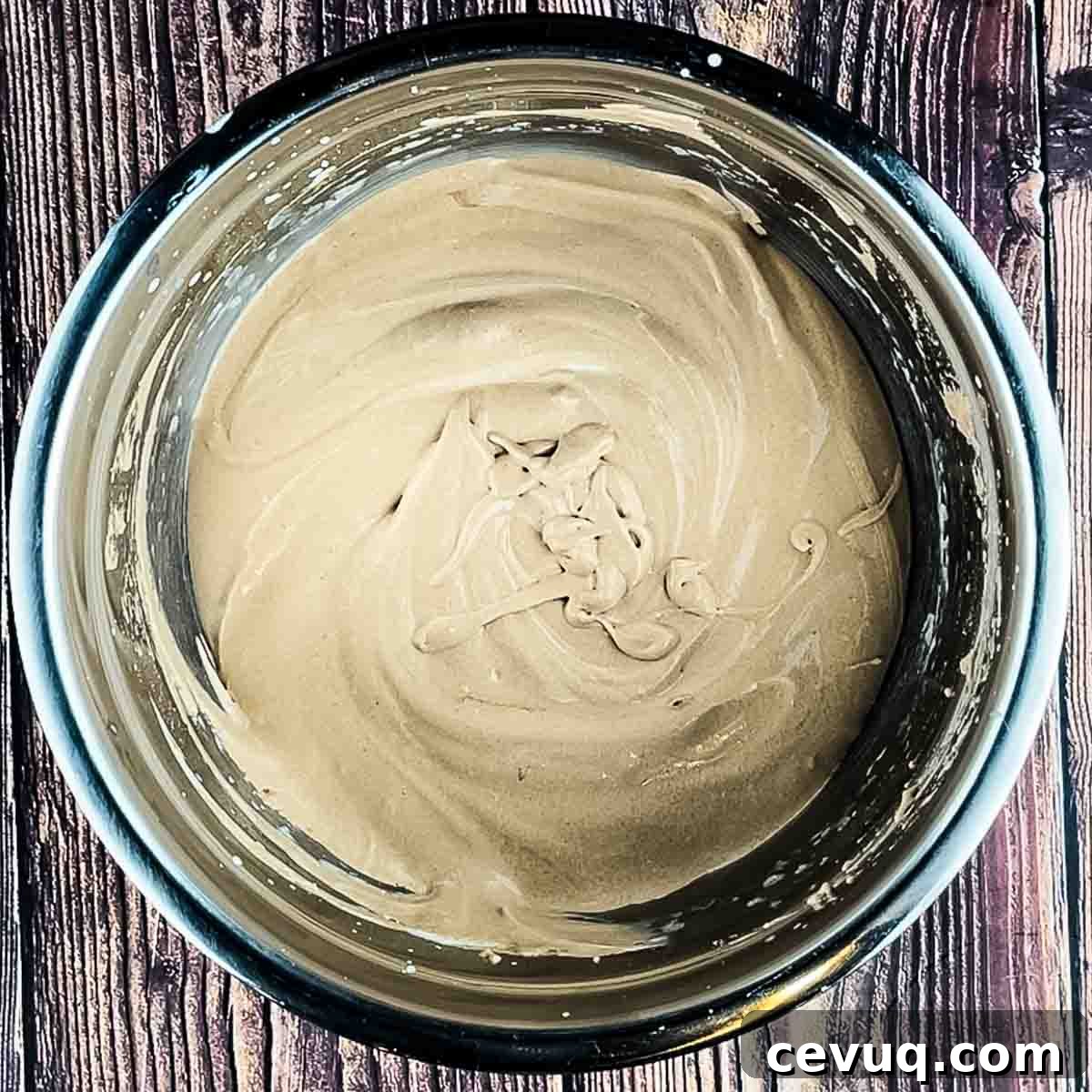 The mixture after it has been folded together in a steel mixing bowl.