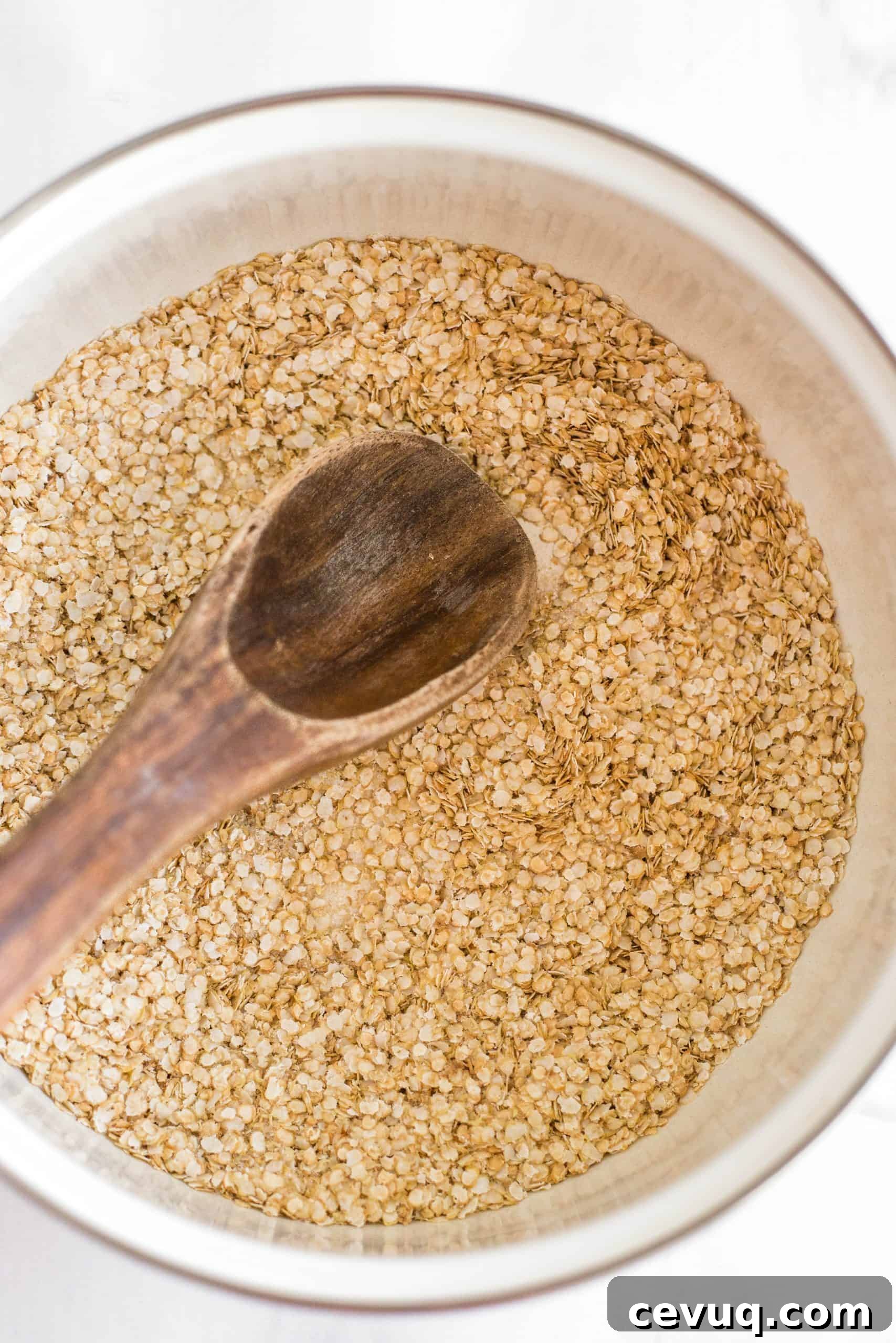 5-Minute Creamy Quinoa Porridge (Gluten-Free, Vegan) Mixing quinoa flakes in a white pot.