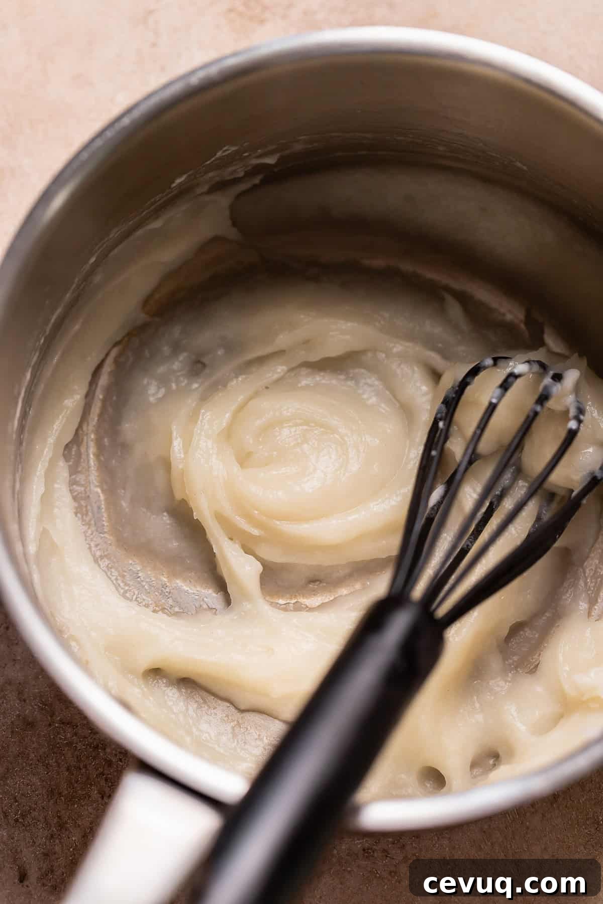 Pumpkin Cinnamon Rolls with Cream Cheese Cinnamon Frosting 3 Tangzhong being whisked and cooked in a metal pot.