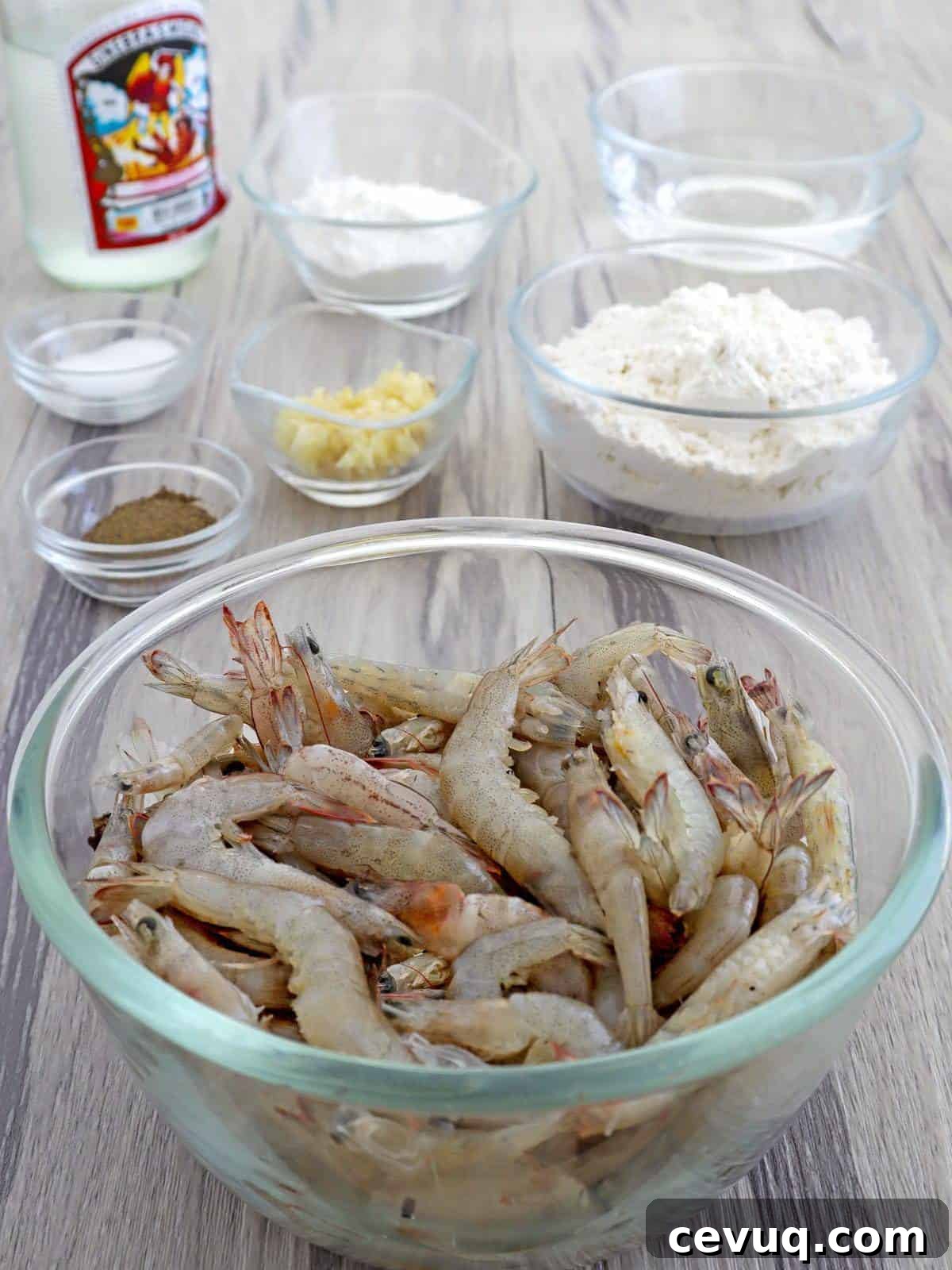 shell-on shrimp, flour, cornstarch, minced garlic, salt, pepper, gin