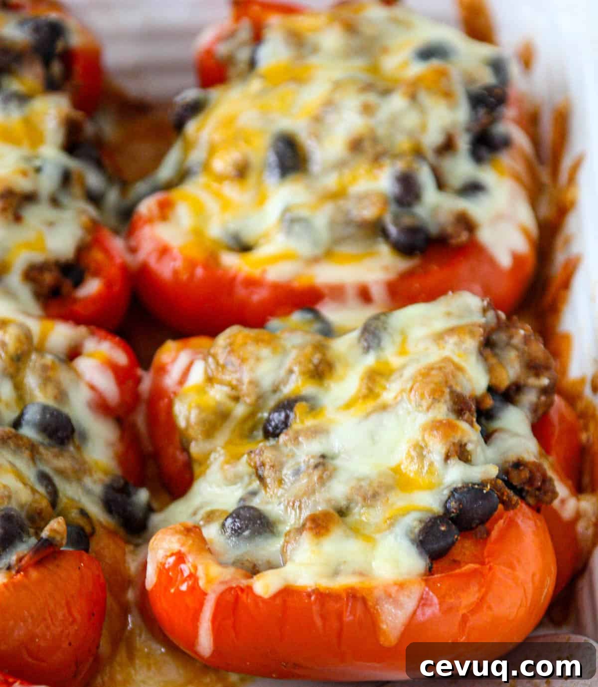 Baked taco stuffed peppers in a casserole dish.