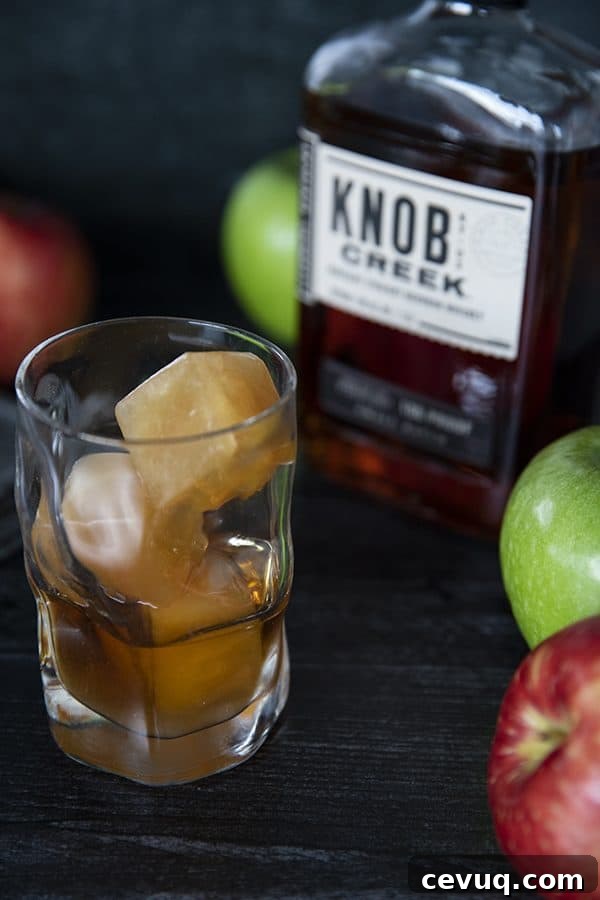 Bourbon and apple cider over cider ice cubes