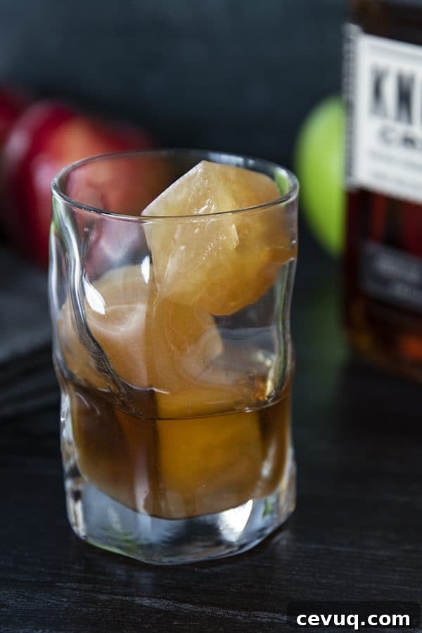 Bourbon bottle and apple cider ice cubes