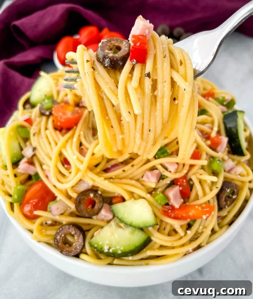 a forkful of spaghetti salad