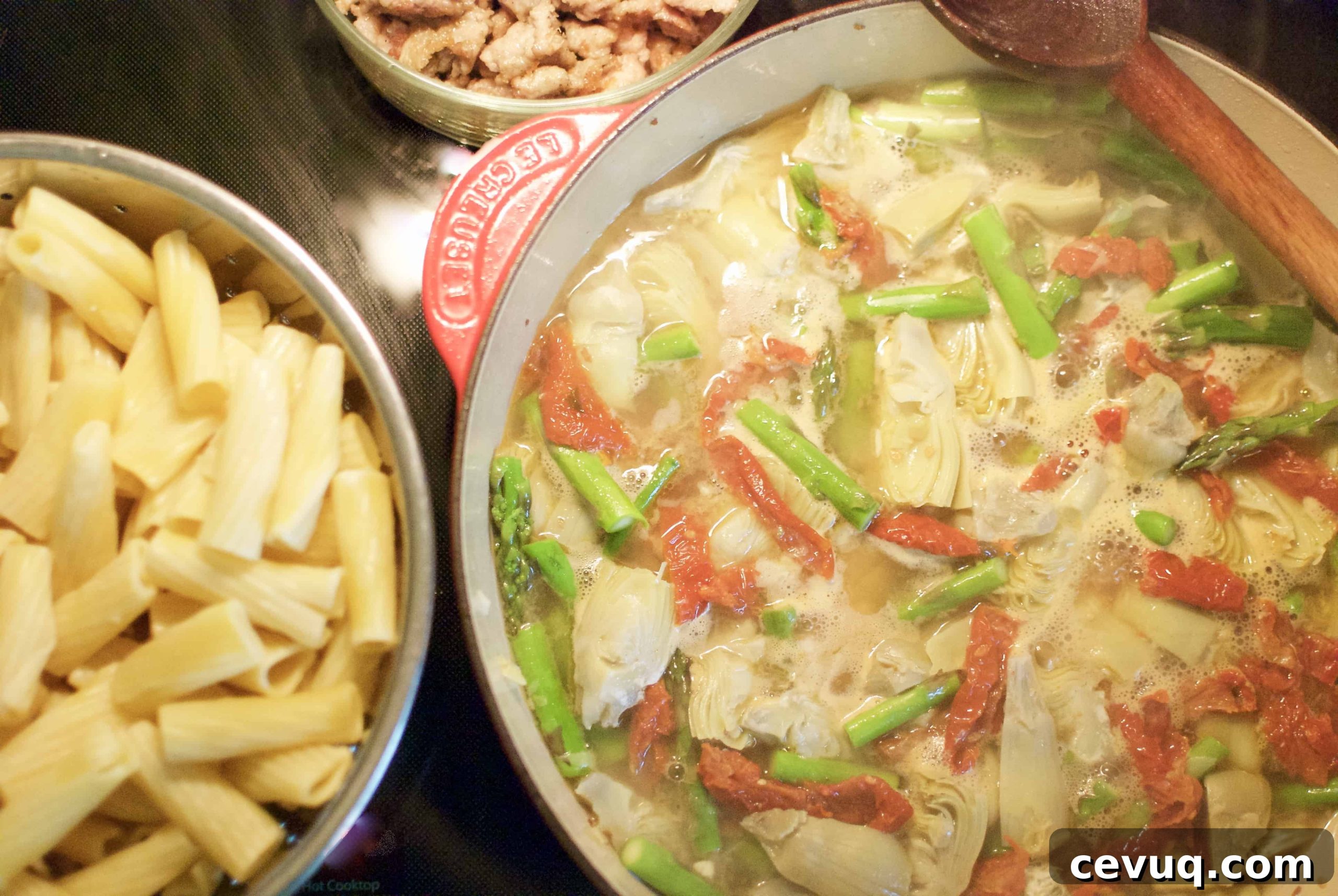 rigatoni with sausage, artichokes & asparagus