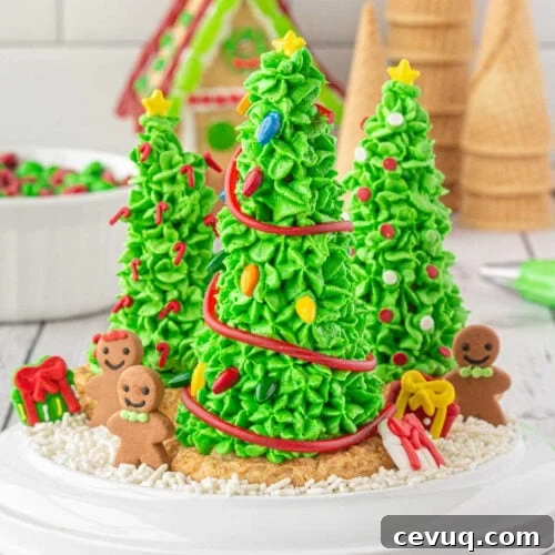 A plate with 3 decorated sugar cone Christmas trees on it.