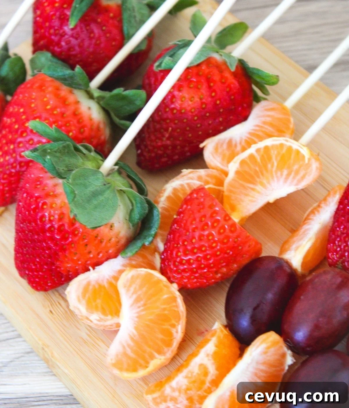 Tanghulu: Traditional Chinese Candied Fruit Guide & Recipe 4 bamboo skewered strawberries, grapes, and oranges