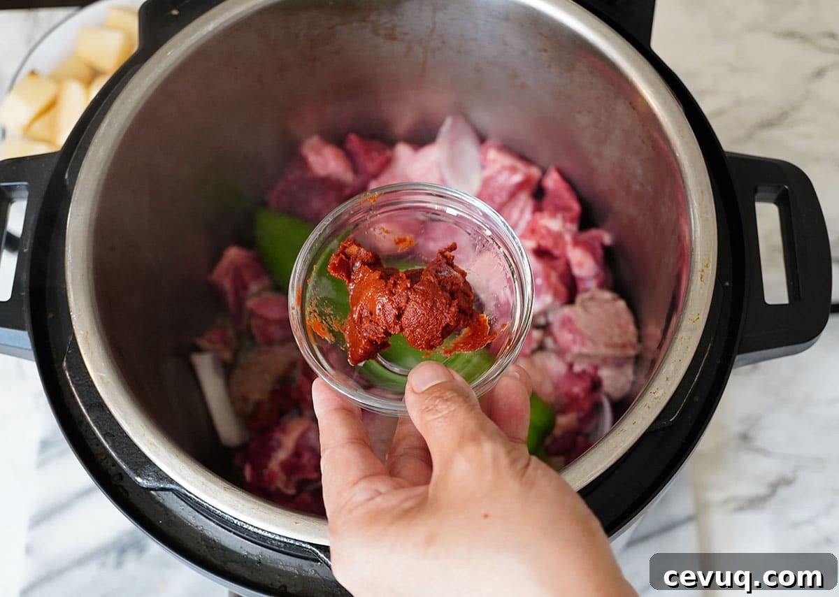 Add the tomato Paste