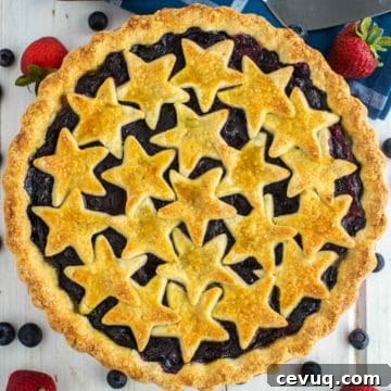 overhead shot of strawberry blueberry pie in pie plate