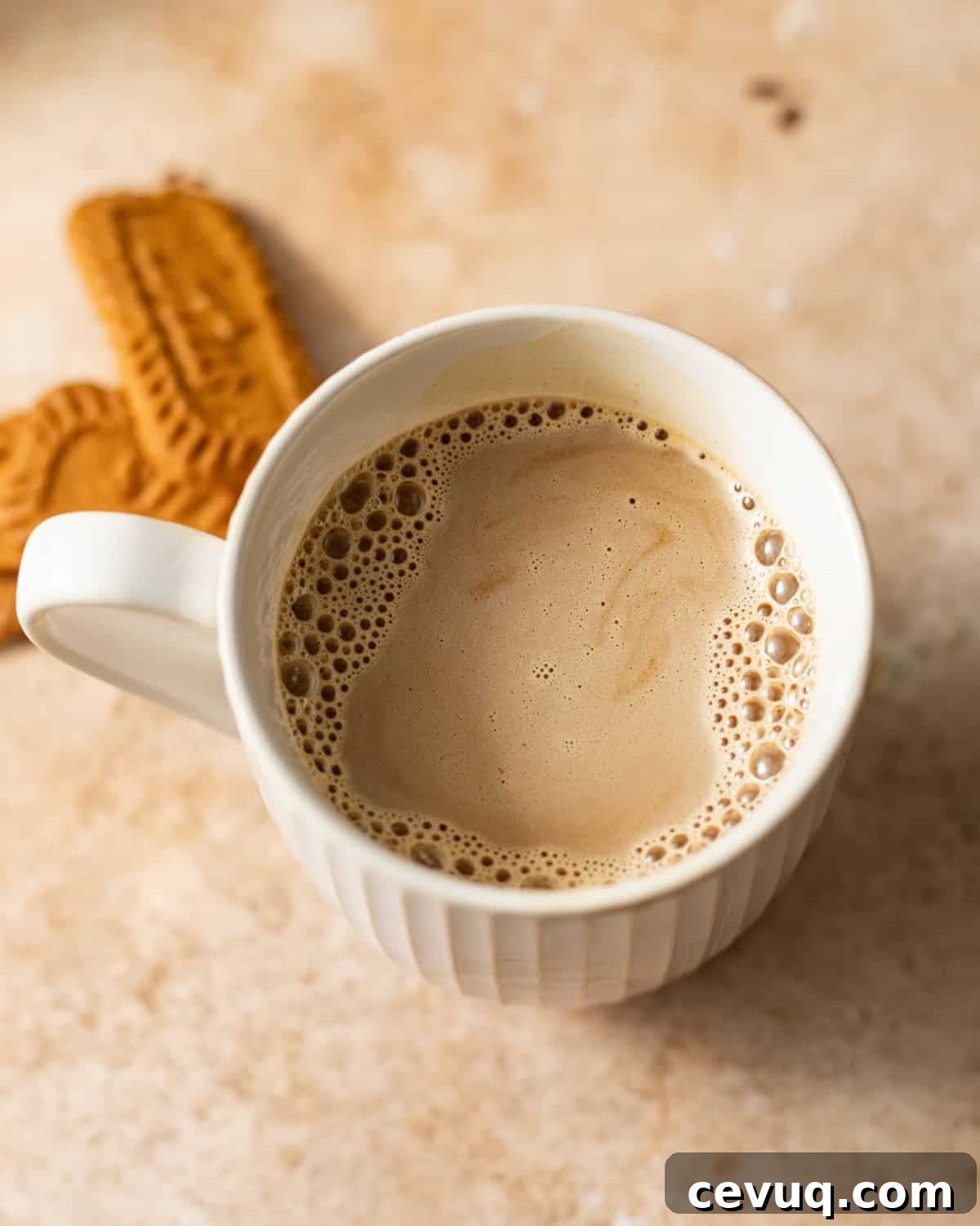 cookie butter latte mixed together in a cup.