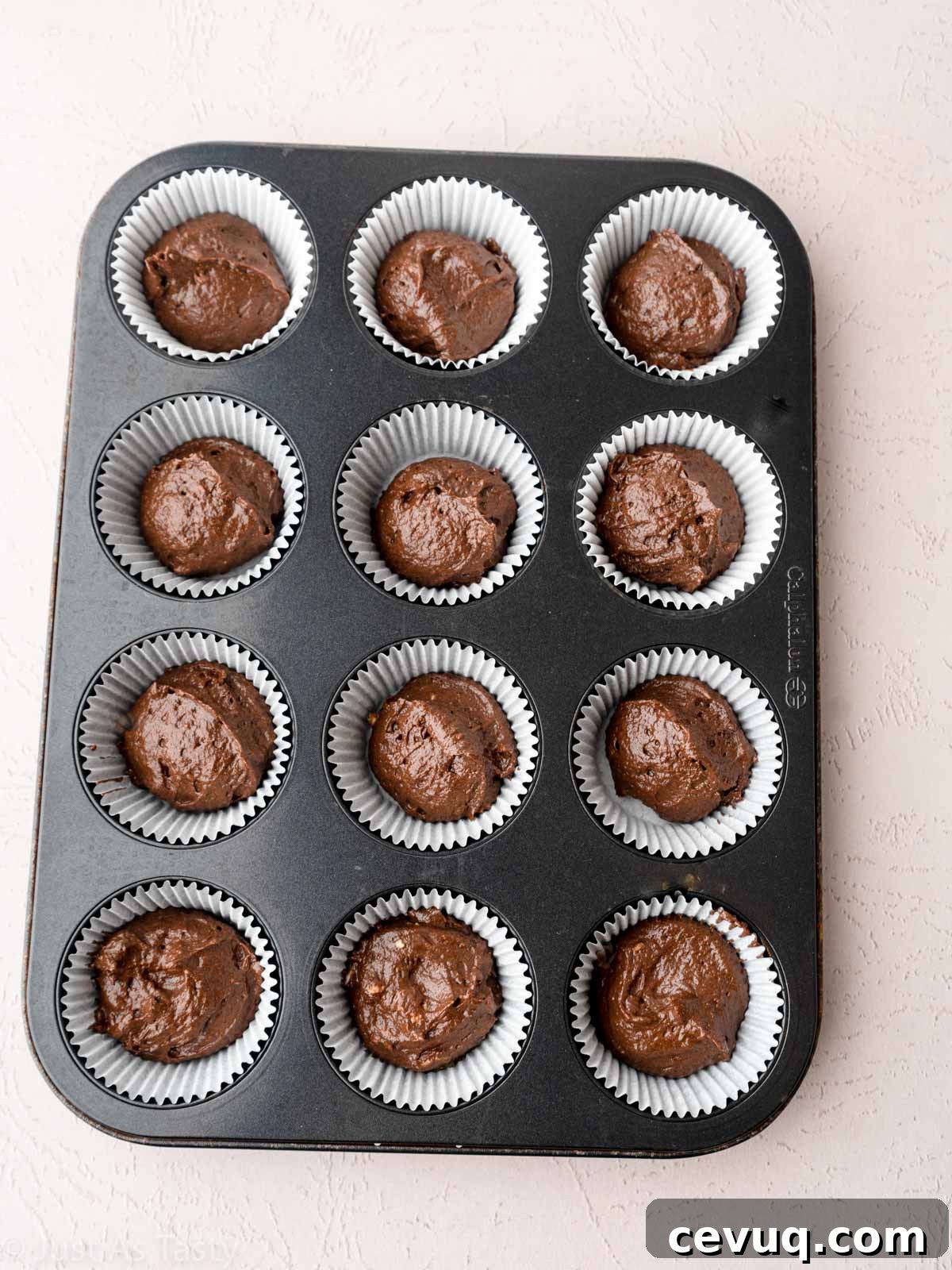 Candy Corn Cupcakes for Halloween: Festive Cupcake Recipe 8 Chocolate cupcake batter in cupcake liners.