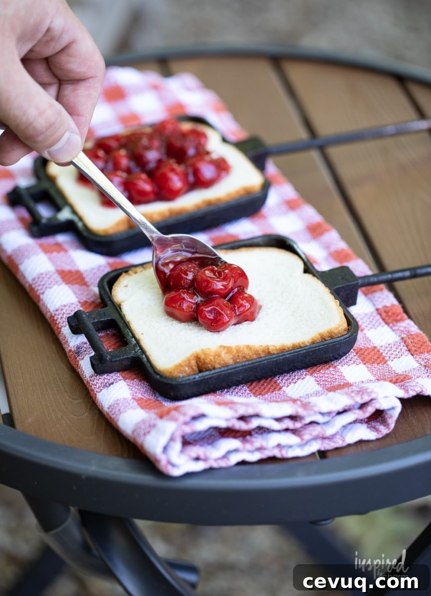 making a cherry mountain pie in mountain pie maker.