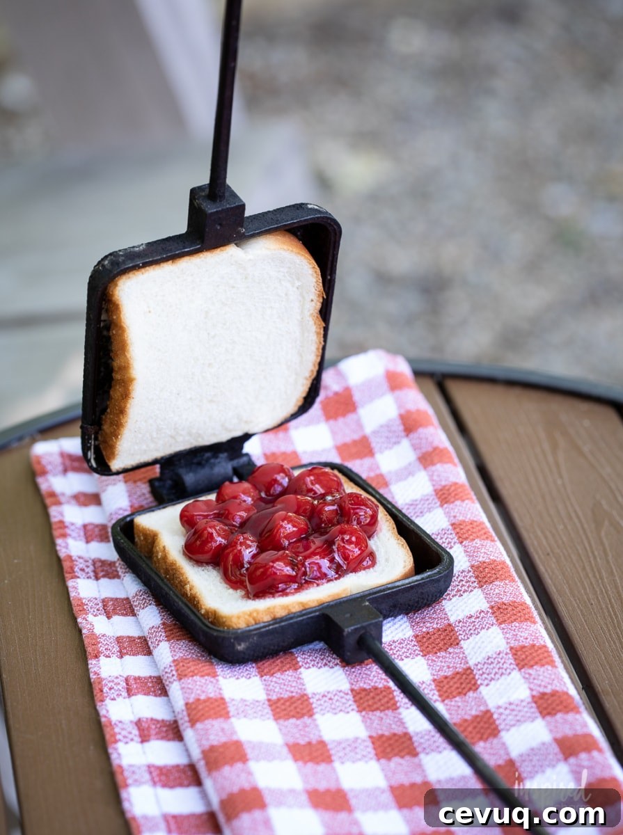 making a cherry mountain pie in mountain pie maker.