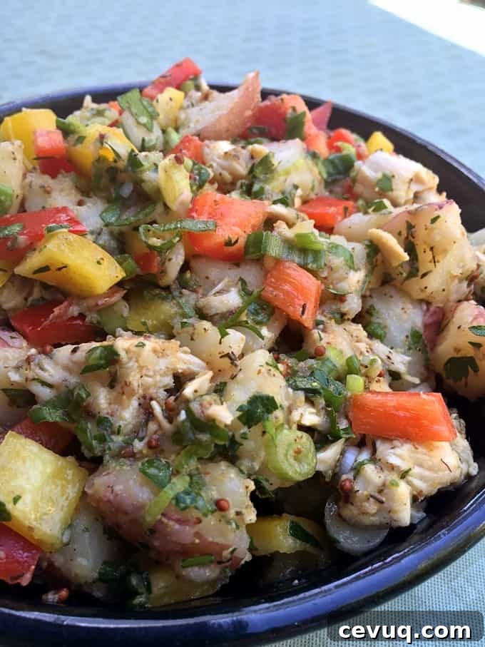 Potato Salad with chicken in blue bowl.