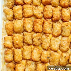 Bubbly cheesy cowboy casserole topped with crispy tater tots