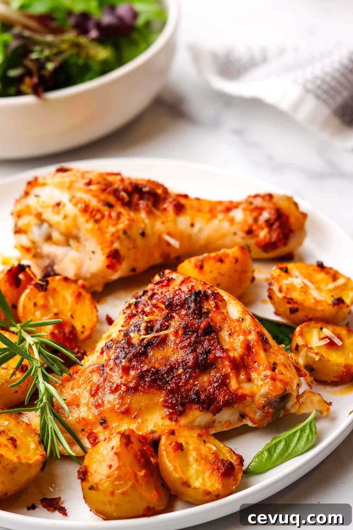 roasted chicken and potatoes served on a plate,