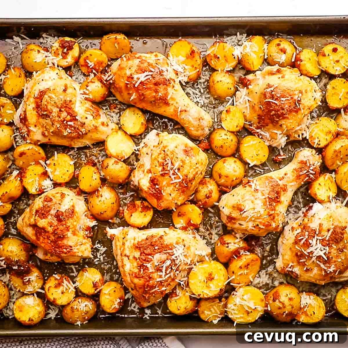 a baking sheet with sun dried tomato pesto chicken
