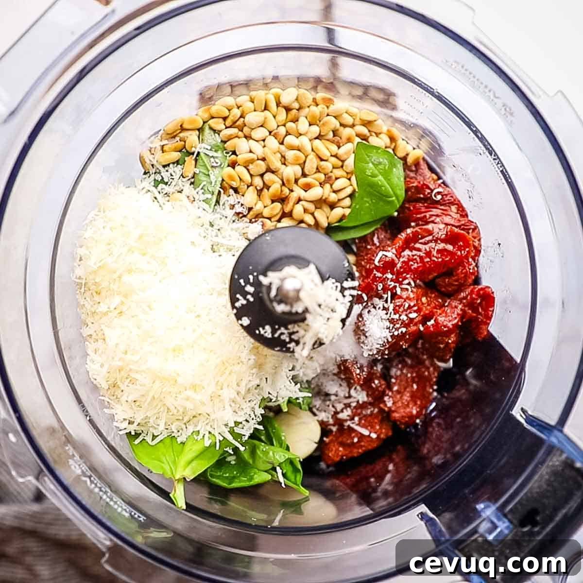 ingredients for sun dried tomato pesto in a food processor